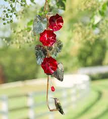 This unique hummingbird feeder is made from recycled tin cans and hold nectar out of the sun to prevent spoiling. Morning Glory Hummingbird Feeder Wind And Weather