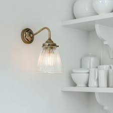 fisher wall light in antiqued brass in