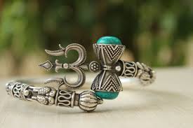 Designed Around An Exquisitely Shaped Trishul And Damroo With Turquoise Stones This Beautiful Kada Has Parrots On Th Shiva Tattoo Design Shiva Tattoo Trishul