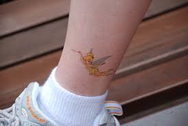 Vibrant tinkerbell tattoo on waist. Tinkerbell Tattoo Designs Tattoo Pictures Online