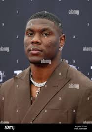 Keion White walks the red carpet of the 2023 NFL Draft at the National WWI  Museum and Memorial in Kansas City, MO