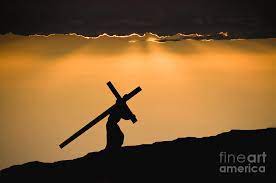 Jesus carries his cross on the way to his crucifixion while wearing a crown of thorns and purple robe placed on him by soldiers. Jesus Christ Carrying The Cross By Wwing
