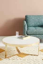 Each serves as a venue to display a collection of books or curios, while. White Marble Lirit Coffee Table Anthropologie