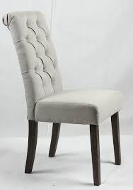 Whether you're looking for ornate, upholstered traditional chicago dining chairs or subdued, sleek dining chairs to accent your modern dining room browse our wide selection of elaborately carved traditional dining chairs, or comfortably casual woven dining room chairs to match your style. Light Grey Upholstered Dining Chair With Buttoned Backrest