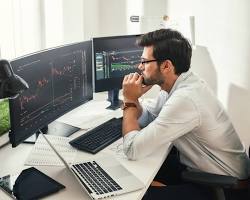Image of person looking at a stock chart