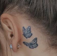With no color inside the wings but that of the ink around the butterfly tattoos, this is an easy and affordable tattoo to get. Pin By On Tattoos Tattoos Blue Butterfly Tattoo Behind Ear Tattoo