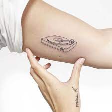 A simple and elegant tattoo if you want something. Record Player Tattoo By Sara Kori Tattoogrid Net