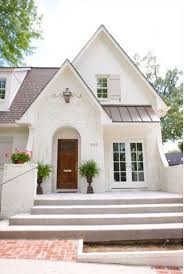Black And White Brick Paint Love This Cozy White Painted Brick Home House Exterior Cottage Exterior Exterior Brick