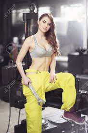 Slim woman, kickbox fighter working out. Nice Sexy Woman Mechanic Holding Wrench Girl Weared In Yellow Stock Photo Picture And Royalty Free Image Image 59583098