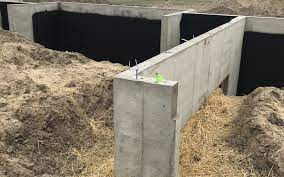 Building concrete steps requires a knowledge of mixing and pouring concrete, making concrete forms, and using tools, like hammers, drills, levels, and so on. Pouring A Foundation For New Home Construction In The Winter Woods Builders