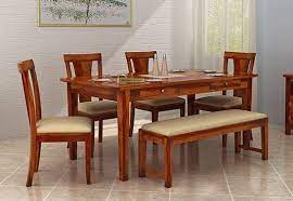 You can use the dining table as a large desk or game table while still being in the mix with people in the living room. Mcbeth Storage 6 Seater Dining Table Set With Bench Honey Finish 6 Seater Dining Table Dining Table Buy Dining Table