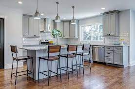 Brass accents including the pendant lights and cabinet handles add a layer of luxury. Florence Grey Shaker Kitchen Cabinets Rta Cabinet Store