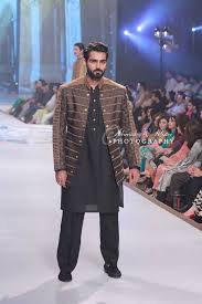 This beautiful bridal salwar kameez sets a new tone to the celebration with its grace and charm in it's deep red resham work and hand crafted kameez and salwar in raw silk with a matching raw silk dupatta. Pentene Bridal Couture Week 2014 2015 Latest Pakistani Wedding Dresses By Famous Designers