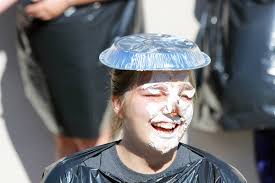 Pies in the face draw big laughs at fundraiser
