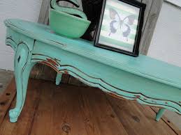 Add three layers of service top, drawer storage and lower display shelf all built into a sturdy package. Vintage Wooden Oval Coffee Table With Cuvy Legs In Distressed Etsy Green Distressed Furniture Distressed Furniture Oval Coffee Tables
