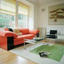 Side cases in lacquered wood with castors. Eileen Gray Sofa