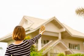 Small Home Model In Woman Hand Front A Home In 2020 Small House Home Loans Investment Property