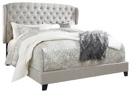 Place at the foot of your bed for a place to sit and it can hold linens and blankets, or a place to store your decorative pillows while you. Jerary Upholstered Bed Ashley Homestore Canada