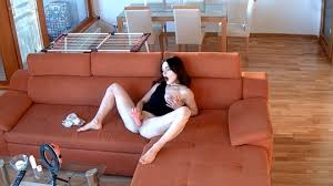 RealLifeCam Olimpia fucks her pussy with dildo while watching porn