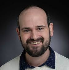 Hi everyone. We just saw a largish bird of prey hovering (well kind of  gluiding) in one place about a motorway verge. It was bigger than a kestrel  and wasn't doing the