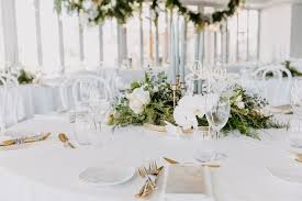 Dy O Events Aka Duo Modern Round Wedding Table Arrangement With Taper Candles In Gol Table Arrangements Wedding Round Wedding Tables Candle Table Decorations