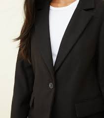 Harris's look spoke a thousand words. Petite Black Revere Collar Longline Coat New Look