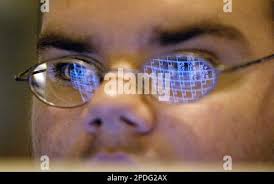 RETRANSMISSION TO CORRECT SPELLING OF STEREOTYPE IN SECOND SENTENCE ** With  the scoreboard monitor reflected in his glasses Twin Valley High School  bowling team member Jared Zimmerman, 16, watches his teammates