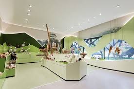 The Feeling Of Being In Nature Is Complemented By An Abstract Forest Relief In Various Shades O Retail Interior Design Commercial Interior Design Retail Design