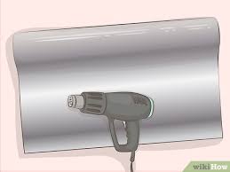 By wrapping your kitchen doors, cabinets, cupboards. 7 Easy Ways To Wrap Cupboard Doors Wikihow