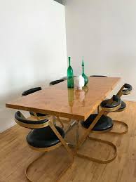 With a coffee table that converts to a dining room table, or vice versa, you're effectively getting two pieces of furniture to the price of one. Jonathan Adler Burled Bond Dining Table With 6 Dwell Chairs Chairs Are Cheap But Kind Of Chic I Dining Room Table Decor Dwell Chairs Dining Room Inspiration