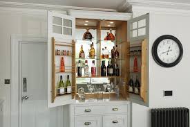 Looking for a cocktail cabinet to impress your guests? Bespoke Drinks Cabinet Wine Storage Charlie Kingham Surrey