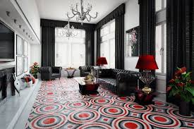 A black and white, flat weave rug that will serve up some graphic but grounding impact the moment you lay it down. How To Design Your Room Decor Around Your Bold Area Rug