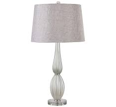 This streamlined table lamp pairs either a concrete or marble base with a metal body and tops it with a classic linen shade, celebrating natural materials in a refined shape. Best Table Lamps