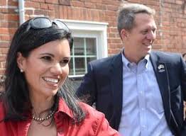 Mayor Frank Crenshaw, left, talks with Rep. James Smith, middle, Democratic  nominee for South Carolina Governor, and running mate Rep. Mandy Powers  Norell, right, as they visit in the town square in