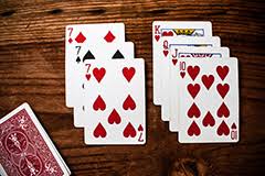 Before gameplay can begin, every player must draw a card from a shuffled deck. Game Chat Home