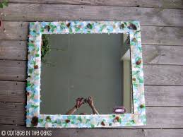 How To Make A Sea Glass Mirror Cottage In The Oaks This mirror with sea glass detail featured in yankee magazine reminds me of my glass and stone tiled mirror frame.