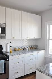 This modern farmhouse kitchen looks great with those white hanging cabinets that have the same design as the window trims and exhaust hood. Contemporary White Gold Kitchen Foxy Oxie