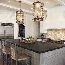 Black granite countertops are still some of the most popular choices all over the world. Gray Wash Kitchen Island With Black Granite Countertops Grey Kitchen Island Black Granite Countertops Replacing Kitchen Countertops