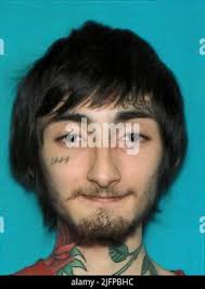 This undated photo provided by the Chicago Police Department shows Eric  Adams. Adams and Michael Washington have been charged with with  first-degree murder in the Chicago shooting death of a woman who