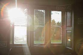 The windows that exclude weather and let in the light are the doctors who stand against the storms of heresy and shed the light of the church's doctrine upon us. Sunlight Shining Through Window Stock Photo Dissolve