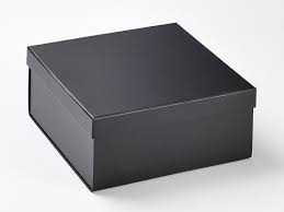 Close up view of cardboard gift boxes with black ribbons isolated on black, black friday. Wholesale Luxury Black Medium Lift Off Lid Gift Box From Foldabox Uk Foldabox Uk And Europe