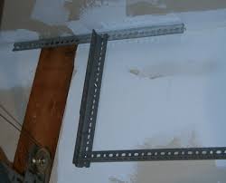 Improve your organization more by drawing an outline around each tool onto the board. Overhead Garage Shelves Using Slotted Angle Iron David Frink
