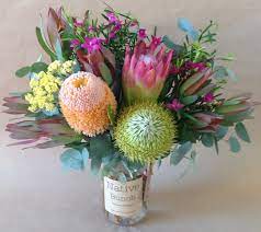 Certain types work best as everyday home decorations, while others are best used for parties and weddings. Native Flowers Banksia Protea Repens Crowea Leucadendrons Cassinea Eucalyptus Posy In A Jar Flower Arrangements Flower Delivery Australian Native Flowers