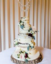 A wide range of silk wedding flowers in many sizes, styles and colours to suit you and your wedding. The Wedding Cake Was 4 Tiers Of Semi Naked Cakes Decorated With Pretty Flowers And Displayed On A Rustic Log Slice At Clock Barn Clock Barn Weddings