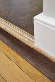 How To Add Floor Trim Transitions And Reducers Young House Love Floor Trim Diy Wood Floors Vinyl Wood Flooring