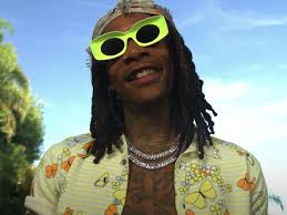 It's a shortening of wizard, which can have the same meaning. Wiz Khalifa Is Still Wiz In New Visual Revolt