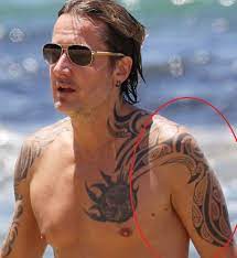 (ap photo/mark humphrey) urban also has a tribal bird tattoo on his left forearm, a sun on his chest, more tribal. Keith Urban S 7 Tattoos Their Meanings Body Art Guru