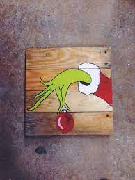 Saving christmas is a lousy ending, way too commercial. The Grinch On Pallet Wood Perfect For Fun Christmas Decor Christmasdecor Winterdecor Pallet Upc Fun Christmas Decorations Christmas Diy Christmas Crafts