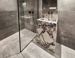 Choose the bathroom fixtures, like the toilet, the sink, and the shower or tub, as well as accessories like storage baskets, shelving, and a mirror. Case Study Designing Sleek Bathrooms Inside The Audo Hotel Designs