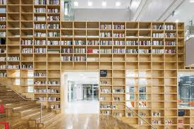 this korean university library uses a two storey slide to attract students to study school building design interior architecture design library architecture